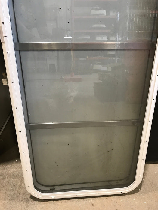 Used Radius Opening Rock Guard Covered Window: 59 1/2"  X 21 1/2"  X 1 1/2" D - Young Farts RV Parts