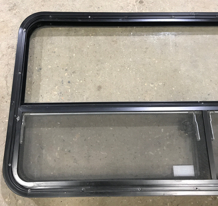 Used Black Radius Window : 53 1/4" W x 25 1/4" H x 2 1/4" D