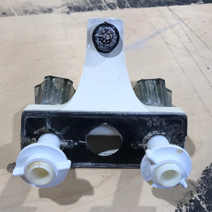 Used 4" Bathroom Faucet, Off White, Smoked Knobs