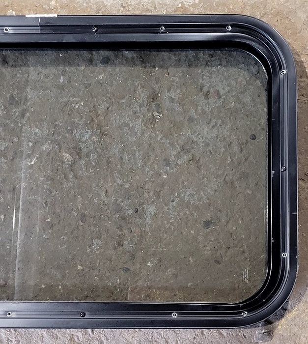 Used Black Radius Non Opening Window : 29 1/2" W x 17 1/2" H x 1 7/8" D - Young Farts RV Parts