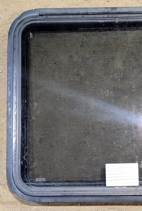Used Black Radius Emergency Opening Window : 29 1/4" W x 25 1/4" H x 1 7/8" D - Young Farts RV Parts