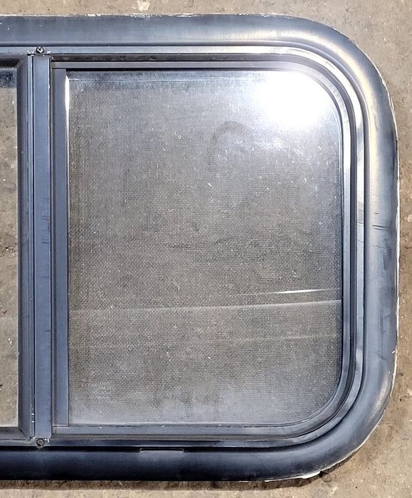 Used Black Radius Opening Window : 23 1/4" W x 14 1/4" H x 1 1/4" D - Young Farts RV Parts
