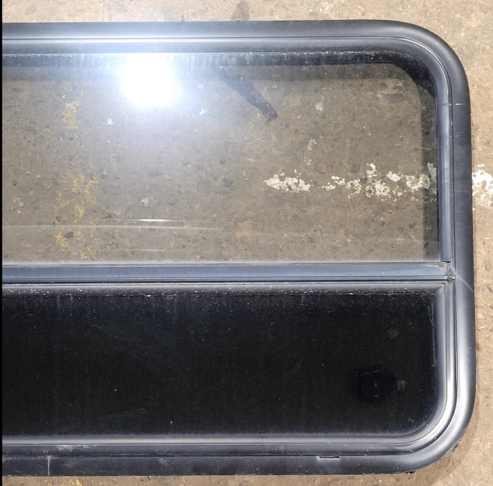 Used Black Radius Opening Window : 29 1/2" W x 21 3/4" H x 1 3/4" D - Young Farts RV Parts