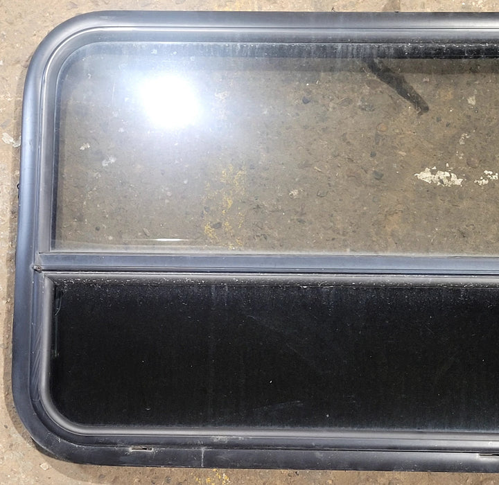 Used Black Radius Opening Window : 29 1/2" W x 21 3/4" H x 1 3/4" D - Young Farts RV Parts