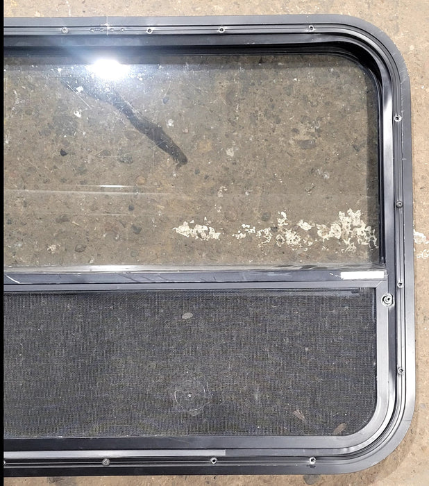 Used Black Radius Opening Window : 29 1/2" W x 21 3/4" H x 1 3/4" D - Young Farts RV Parts
