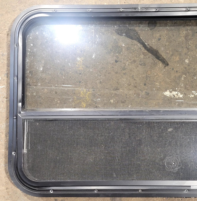 Used Black Radius Opening Window : 29 1/2" W x 21 3/4" H x 1 3/4" D - Young Farts RV Parts