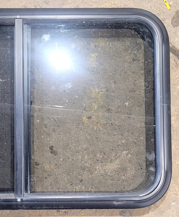 Used Black Radius Opening Window : 29 3/4" W x 19 3/4" H x 1 7/8" D - Young Farts RV Parts