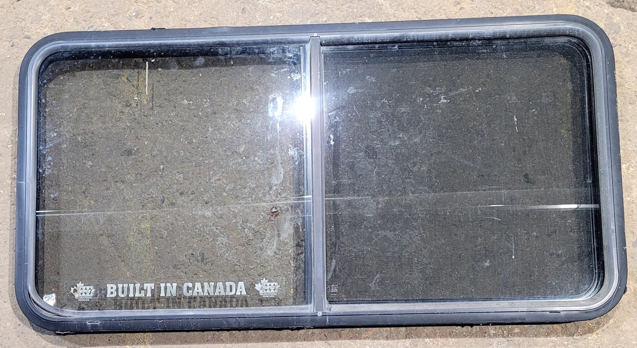 Used Black Radius Opening Window : 47 3/4" W x 23 3/4" H x 1 7/8" D - Young Farts RV Parts