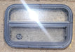 Used Black Radius Opening Window : 23 1/2" W x 14 1/2" H x 1 3/4" D - Young Farts RV Parts