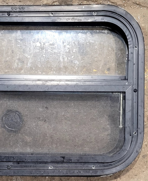 Used Black Radius Opening Window : 23 1/2" W x 14 1/2" H x 1 3/4" D - Young Farts RV Parts