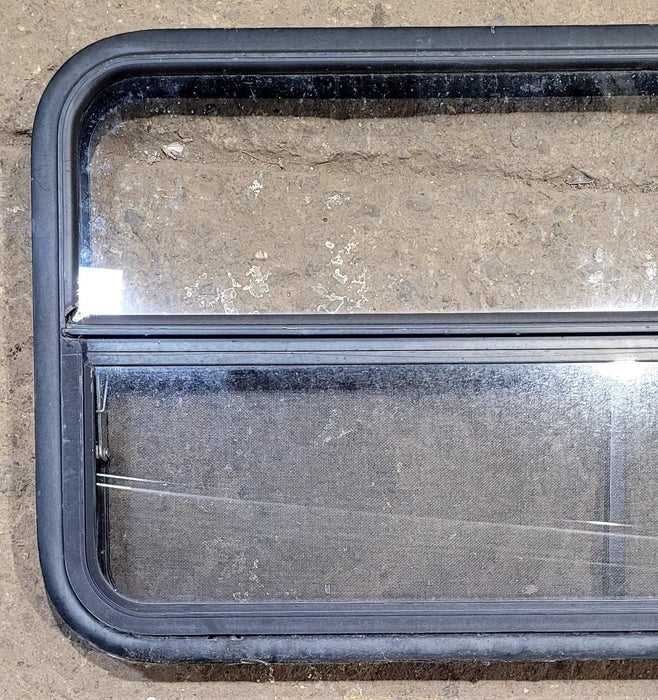 Used Black Radius Opening Window : 41 1/4" W x 21 1/4" H x 1 3/4" D - Young Farts RV Parts