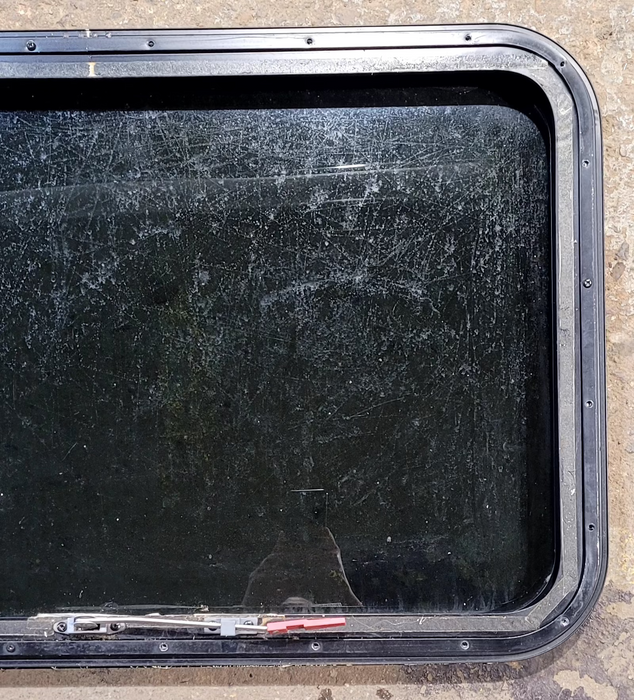 Used Black Radius Emergency Opening Window : 35 1/4" W x 21 1/4" H x 1 1/4" D - Young Farts RV Parts