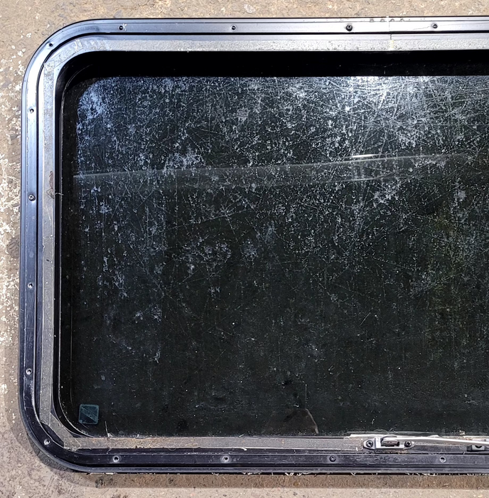 Used Black Radius Emergency Opening Window : 35 1/4" W x 21 1/4" H x 1 1/4" D - Young Farts RV Parts