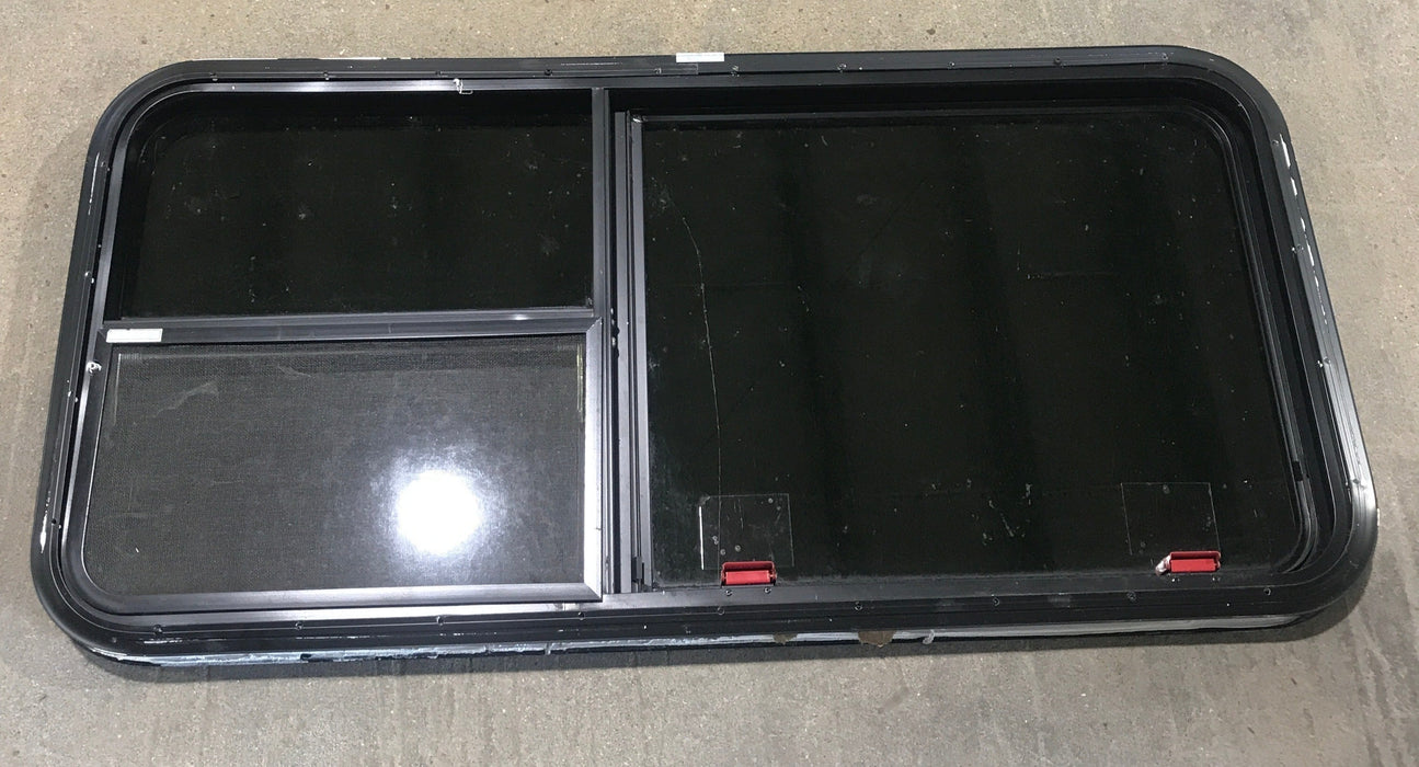 Used Black Radius Emergency Opening Window : 41 1/2" W x 21 1/2" H x 1 7/8"