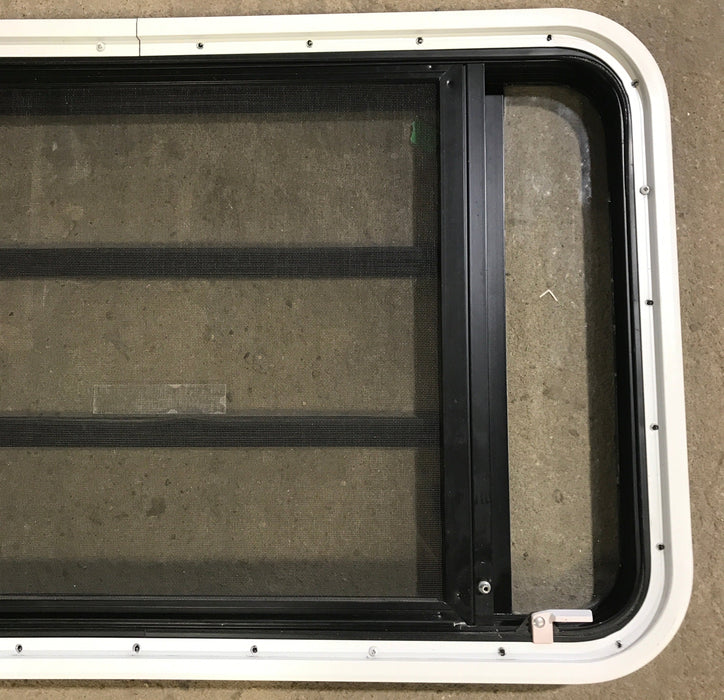 Used Black Radius Emergency Opening Window : 35 1/4" W x 21 1/4" H x 1 7/8" D