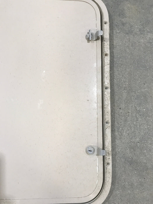 Used Radius Corner cargo door  23 3/4" W  x 21 3/4" H x  1/2" D