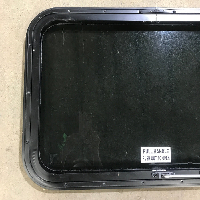 Used Black Radius Emergency Opening Window : 29.5" X 19.5" X 1.5"