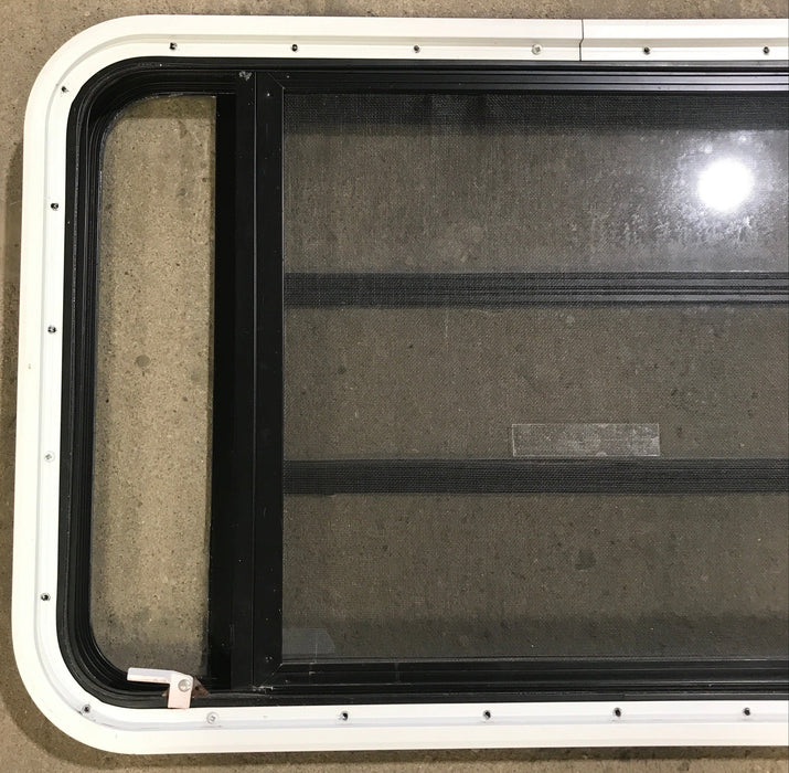 Used Black Radius Emergency Opening Window : 35 1/4" W x 21 1/4" H x 1 7/8" D