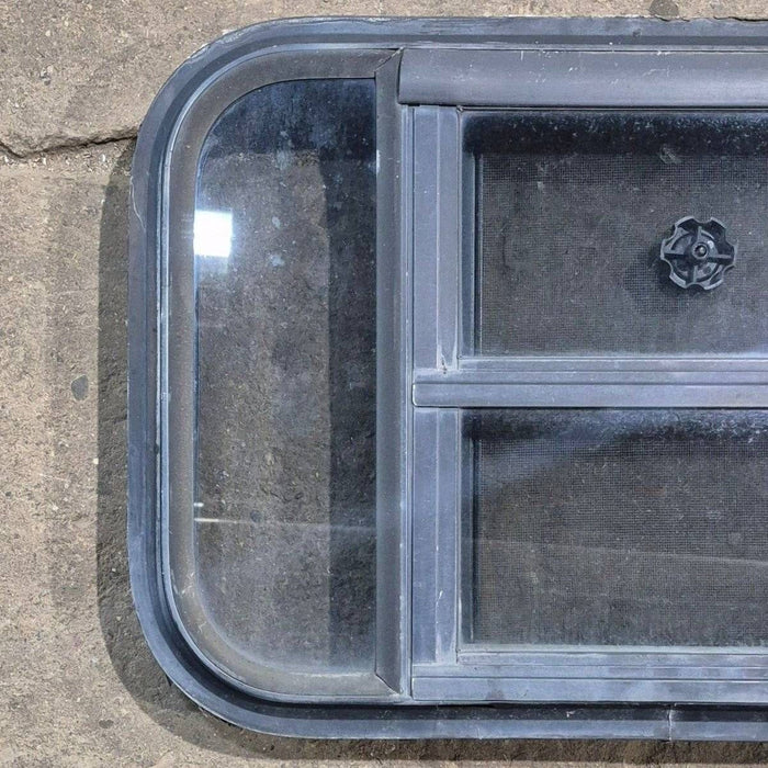 Used Black Radius Opening Window - 23 1/8" X 14 1/2" X 1 7/8"