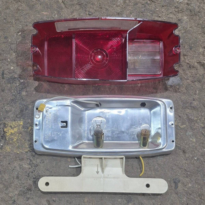 Used Miro-Flex RV Tail Light Assembly, With License Plate Bracket,  10 1/8" X 7" X 2 3/4" - 340