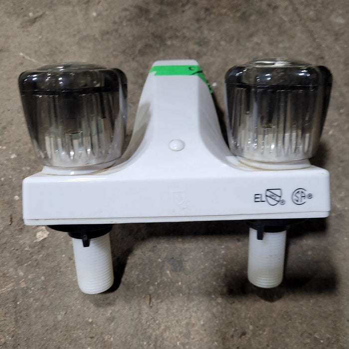 Used 4" Bathroom Faucet, White, Smoked Knobs