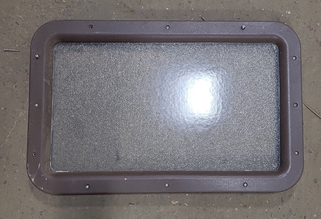 Used Black/ Brown Entry door window : 24 3/4" x 15 3/4"