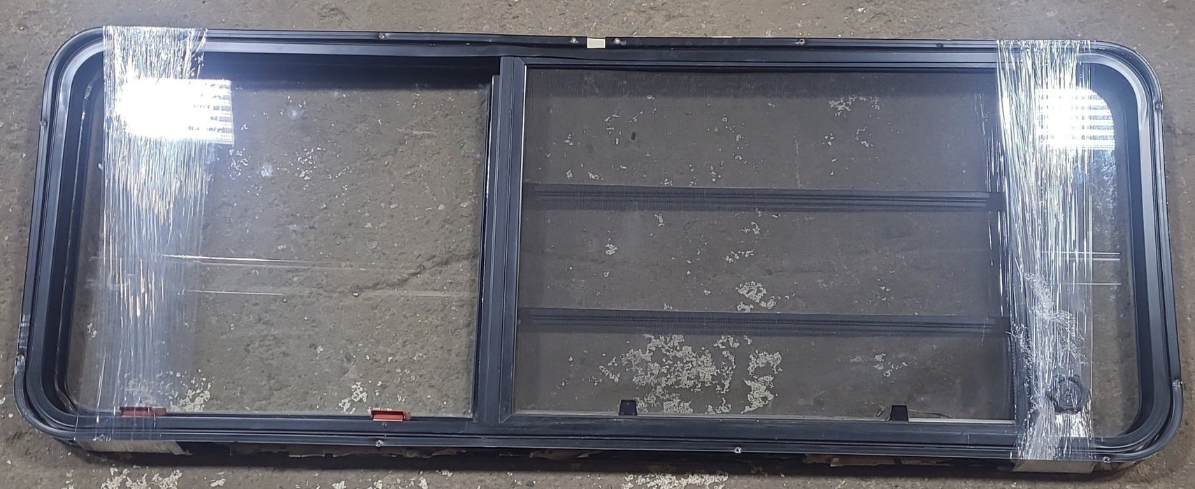 Used Black Radius Emergency Opening Window : 21 3/4" W x 59 3/4" H x 1 1/4" D