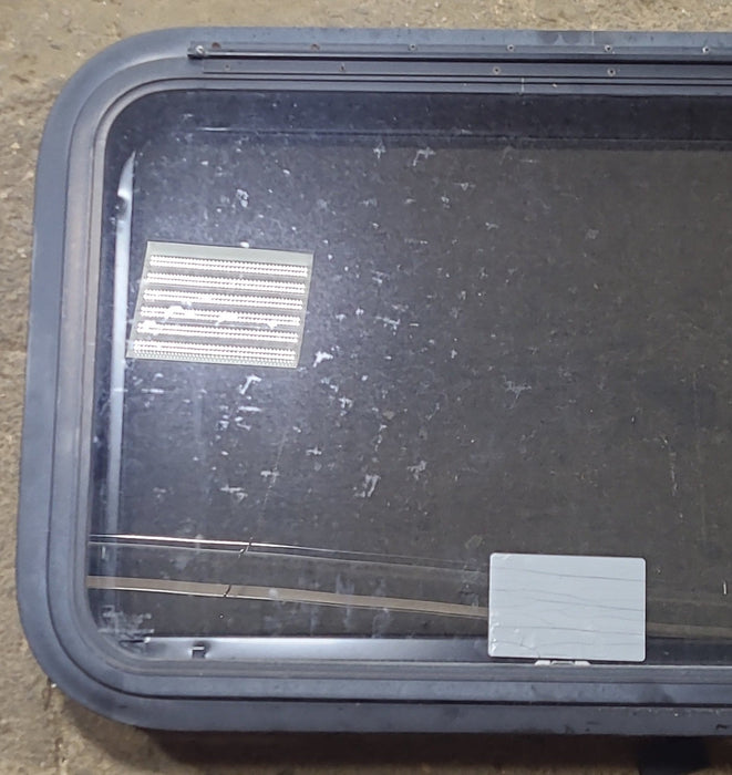 Used Black Radius Emergency Opening Window : 29 1/2" W x 19 1/2" H x 1 3/4" D - Young Farts RV Parts