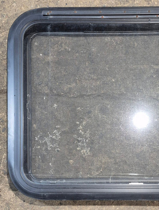 Used Black Radius Emergency Opening Window : 29 1/2" W x 21 1/2" H x 1 1/2" - Young Farts RV Parts