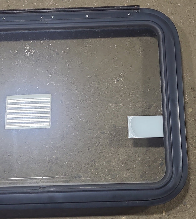 Used Black Radius Emergency Opening Window : 29 1/2" W x 21 1/2" H x 1 3/8" D