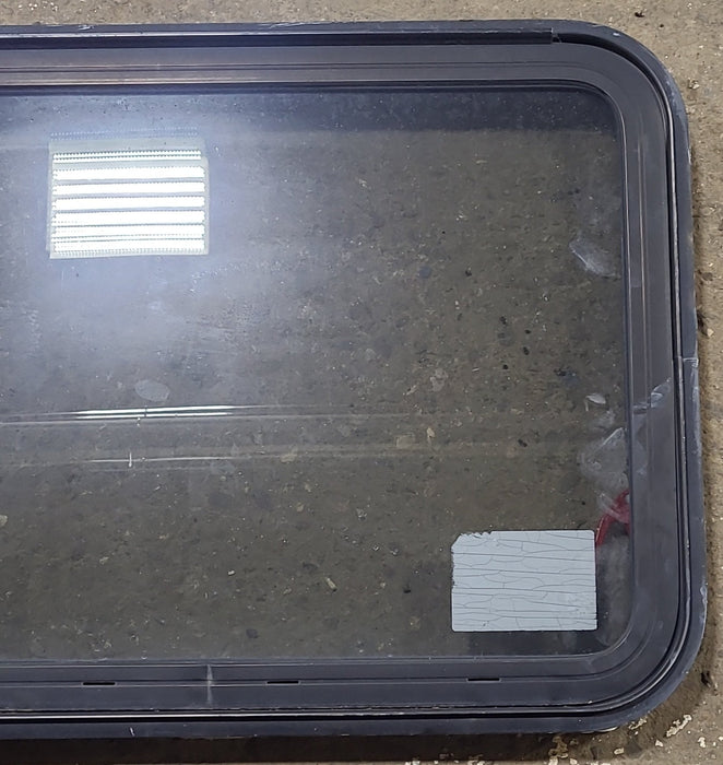 Used Black Radius Emergency Opening Window : 29 1/2" W x 21 1/2" H x 1 7/8" D - Young Farts RV Parts