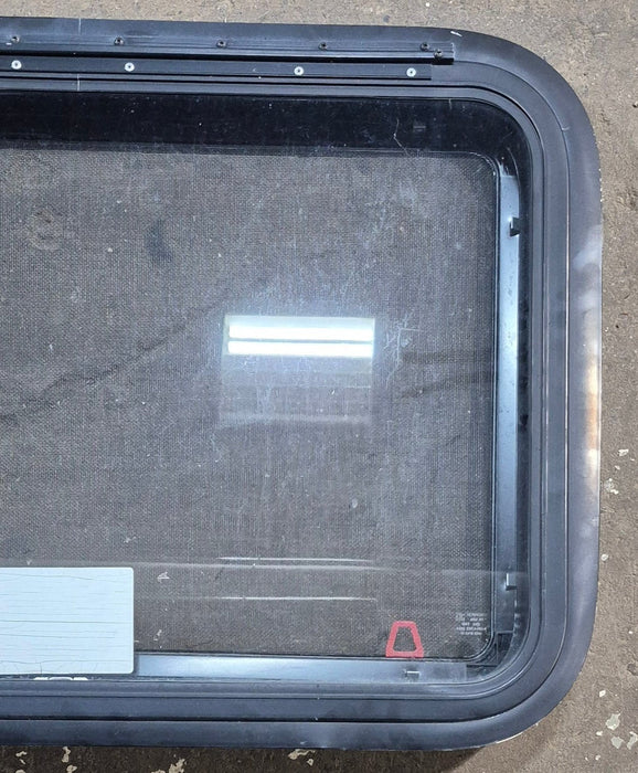Used Black Radius Emergency Opening Window : 29 1/4" W x 19 1/4" H x 1 3/8" D - Young Farts RV Parts