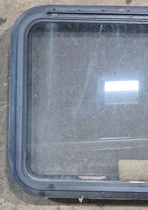 Used Black Radius Emergency Opening Window : 29 1/4" W x 21 1/4" H x 1 7/8" D - Young Farts RV Parts