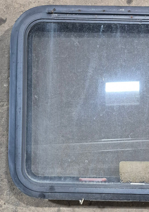 Used Black Radius Emergency Opening Window : 29 1/4" W x 21 1/4" H x 1 7/8" D - Young Farts RV Parts