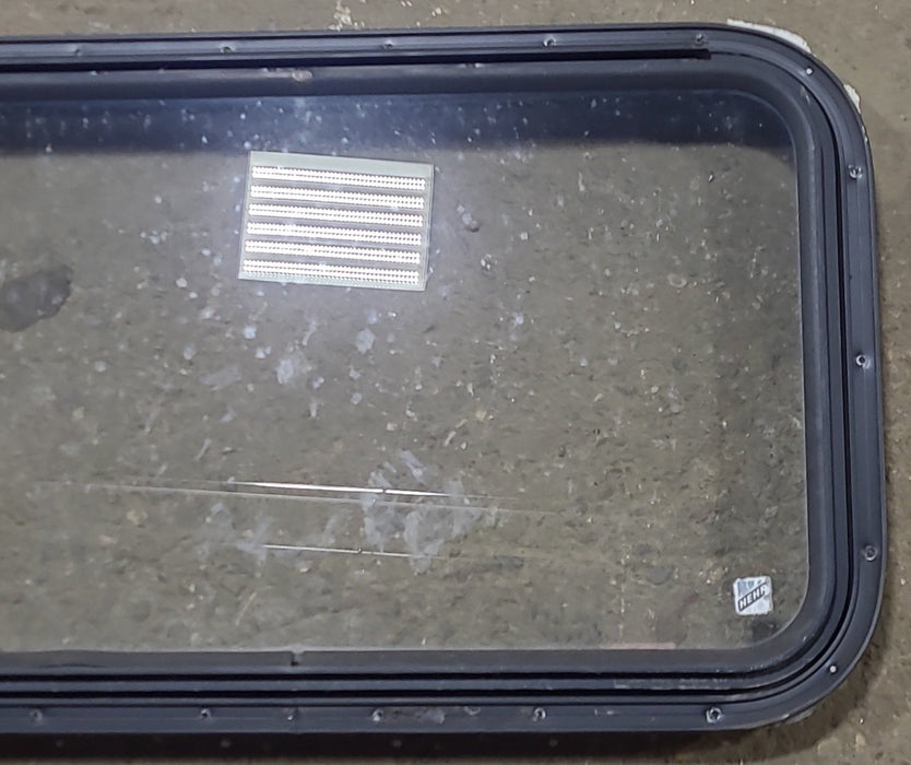 Used Black Radius Emergency Opening Window : 30 3/4" W x 18 3/4" H x 1 5/8" D