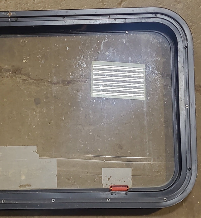 Used Black Radius Emergency Opening Window : 35 1/2" W x 18 1/2" H x 1 7/8" D - Young Farts RV Parts