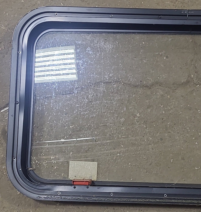 Used Black Radius Emergency Opening Window : 35 1/2" W X 18 3/4" H X 1 3/4" D - Young Farts RV Parts