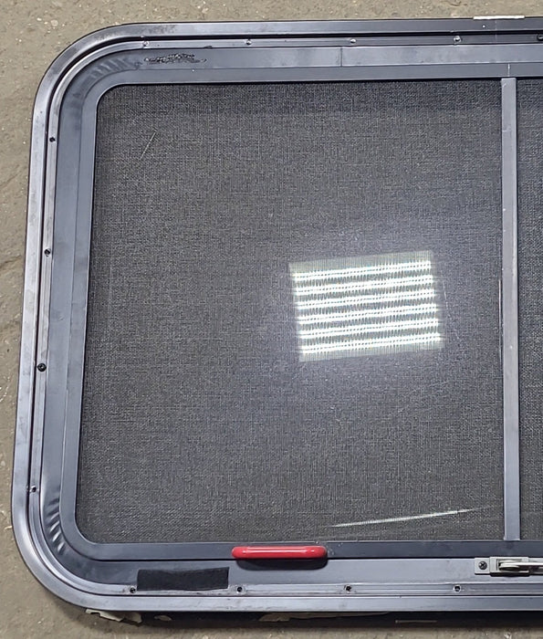Used Black Radius Emergency Opening Window : 35 1/4" W x 21 1/2" H x 1 7/8" D - Young Farts RV Parts