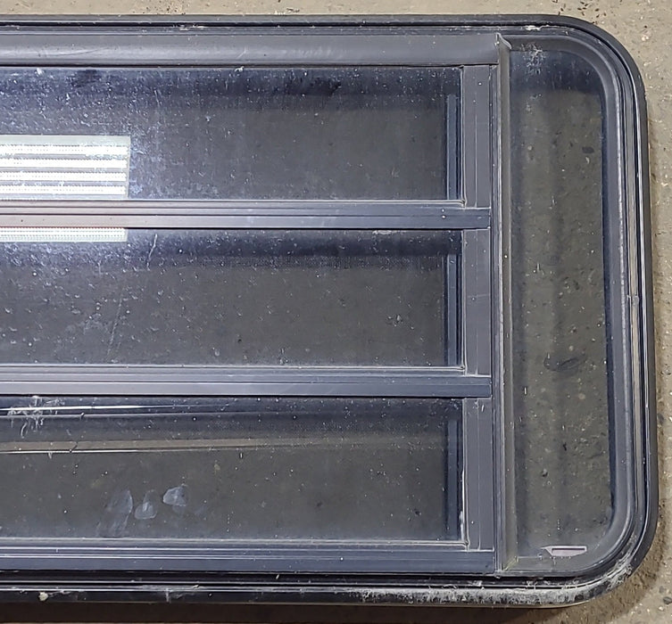 Used Black Radius Emergency Opening Window : 35" W x 21 1/4" H x 1 3/4" D - Young Farts RV Parts