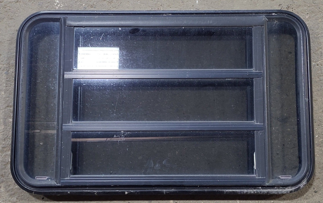 Used Black Radius Emergency Opening Window : 35" W x 21 1/4" H x 1 3/4" D - Young Farts RV Parts