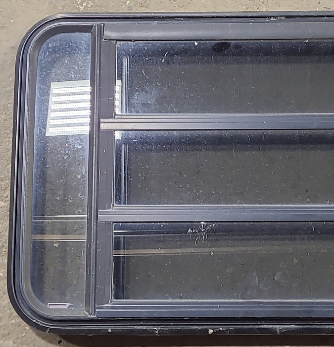 Used Black Radius Emergency Opening Window : 35" W x 21 1/4" H x 1 3/4" D - Young Farts RV Parts