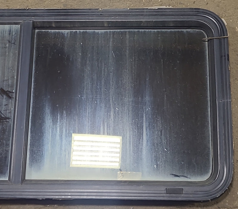 Used Black Radius Emergency Opening Window : 47 5/8" W x 21 1/2" H x 1 7/8" D - Young Farts RV Parts