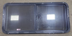 Used Black Radius Emergency Opening Window : 47 5/8" W x 21 1/2" H x 1 7/8" D - Young Farts RV Parts