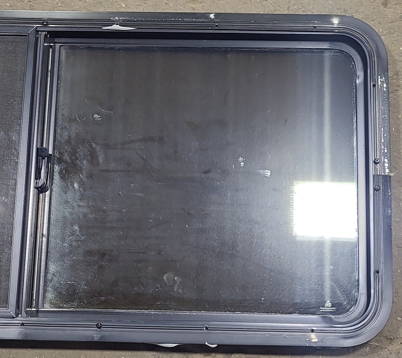 Used Black Radius Emergency Opening Window : 47 5/8" W x 21 1/2" H x 1 7/8" D - Young Farts RV Parts