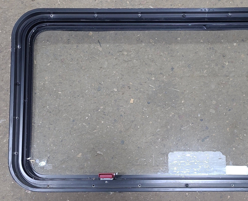 Used Black Radius Emergency Opening Window : 48 1/2" W x 21 3/4" H x 1 3/4" D