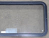 Used Black Radius Emergency Opening Window : 48 1/2" W x 21 3/4" H x 1 3/4" D - Young Farts RV Parts
