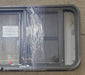 Used Black Radius Emergency Opening Window : 49 3/4" W x 19 1/2" H x 1 7/8" D - Young Farts RV Parts