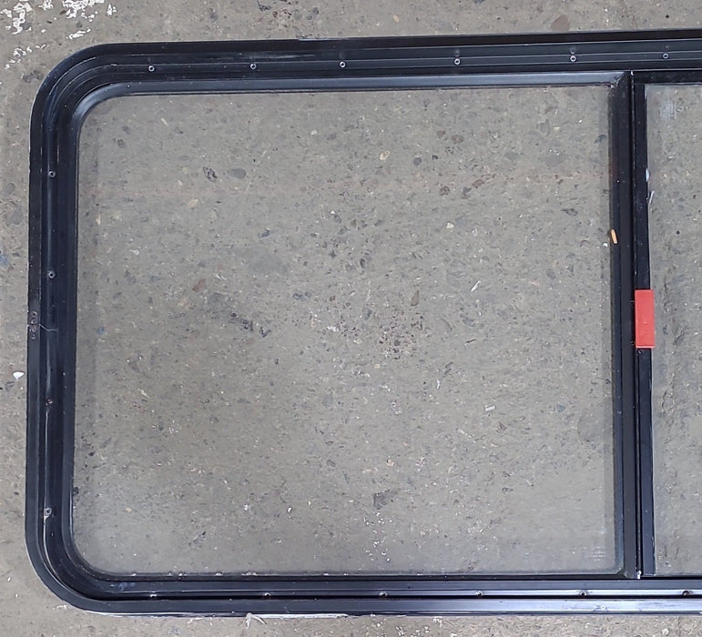 Used Black Radius Emergency Opening Window : 55 1/2" W x 25 1/2" H x 1 7/8" D