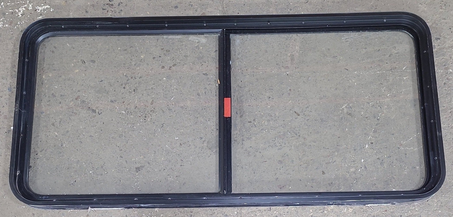 Used Black Radius Emergency Opening Window : 55 1/2" W x 25 1/2" H x 1 7/8" D