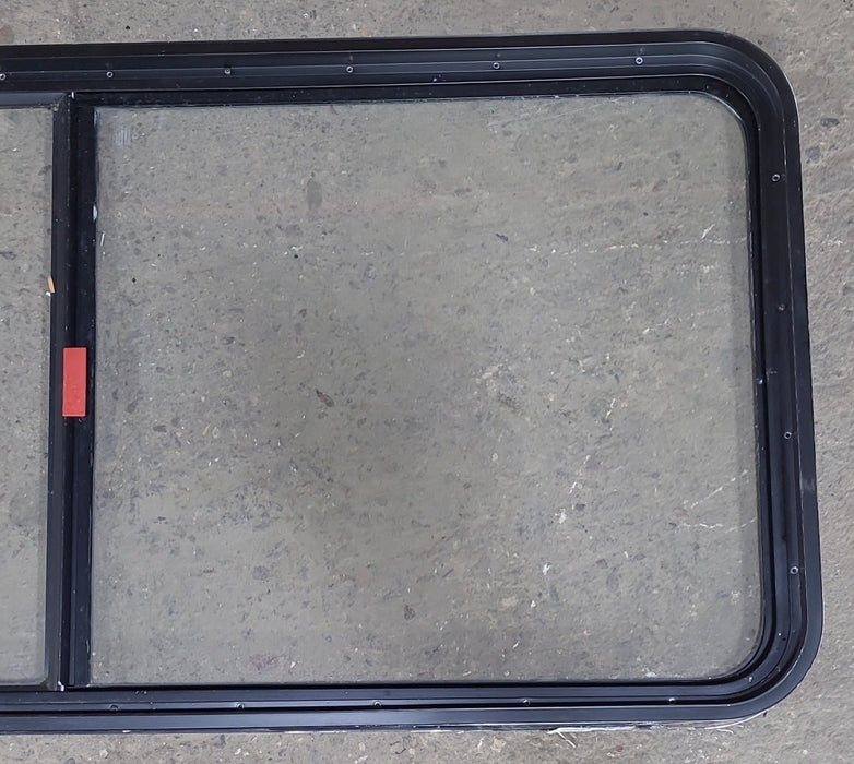 Used Black Radius Emergency Opening Window : 55 1/2" W x 25 1/2" H x 1 7/8" D